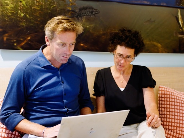 Two people talking about the plan for impact